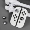 fd140e40-7fb9-41d9-b4a5-e296b46286bd.webp Silicone Thumb Grips for Nintendo Switch